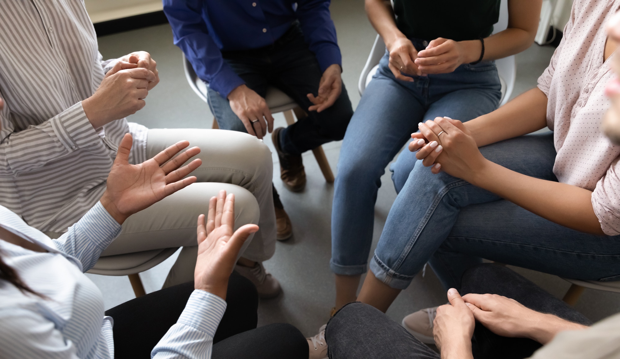 Drug Use and Addiction Among High Earning Professionals Pathfinders - A group of individuals in drug rehab show support for one another by discussing their stories, coping strategies, and treatment successes.