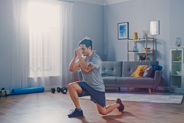 Cold Turkey - A man is exercising in his home. He has stopped drinking cold turkey and uses exercise to get past the withdrawal.