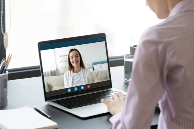 Staying Sober - A woman meets with her therapist over a video chat. Staying sober is more difficult with social distancing. Those in recovery need new ways to connect for support.